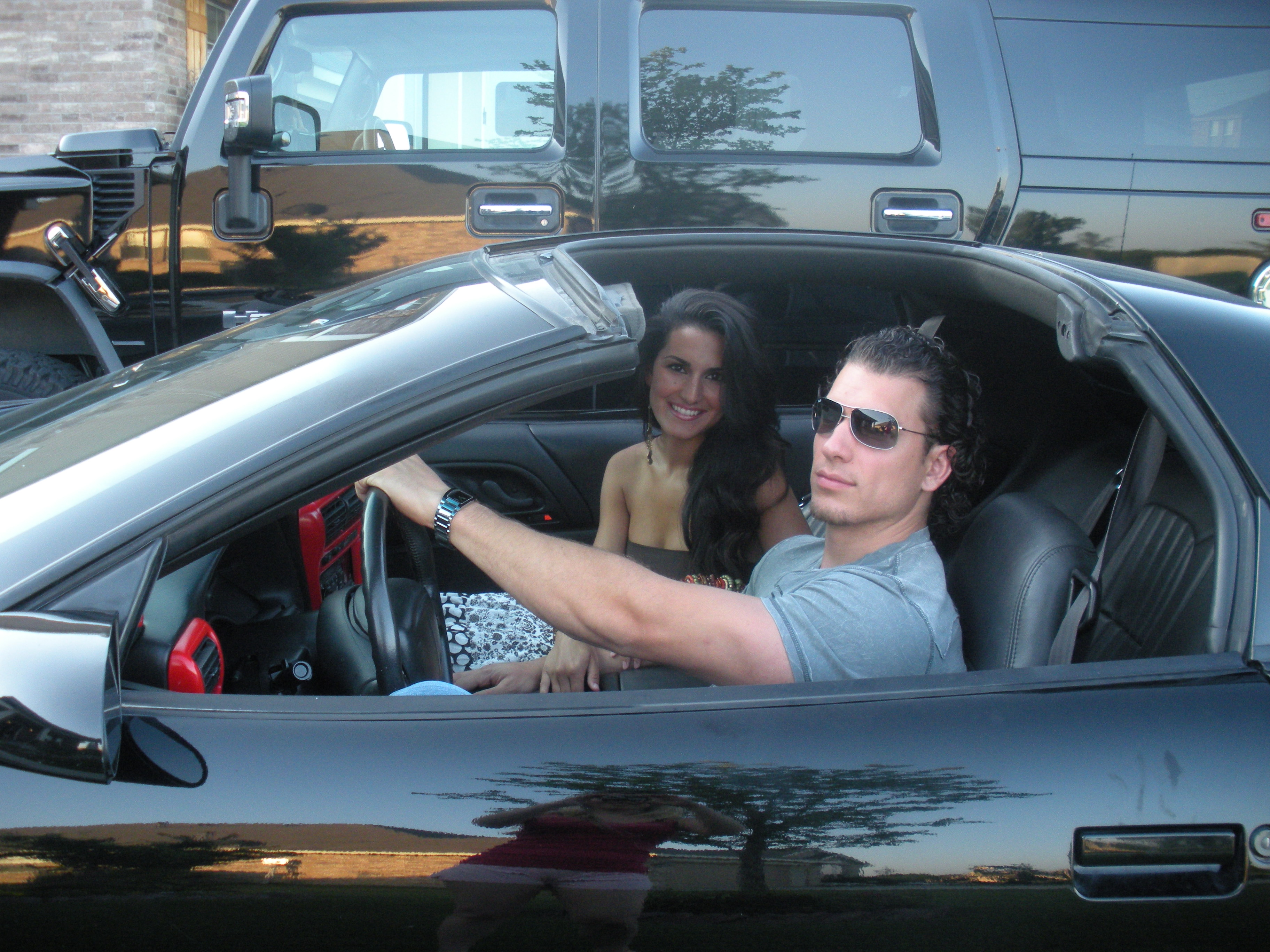 Sean and Priscilla Pruitt in their black Camaro SS