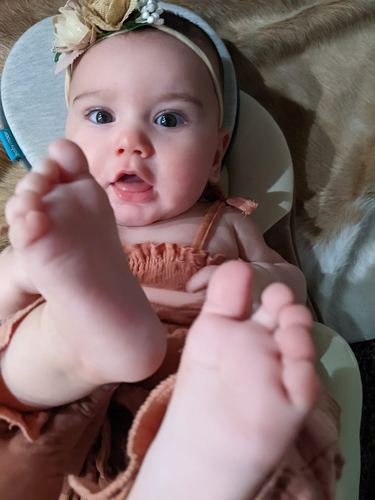 Elle Pruitt at six months old with flower headband